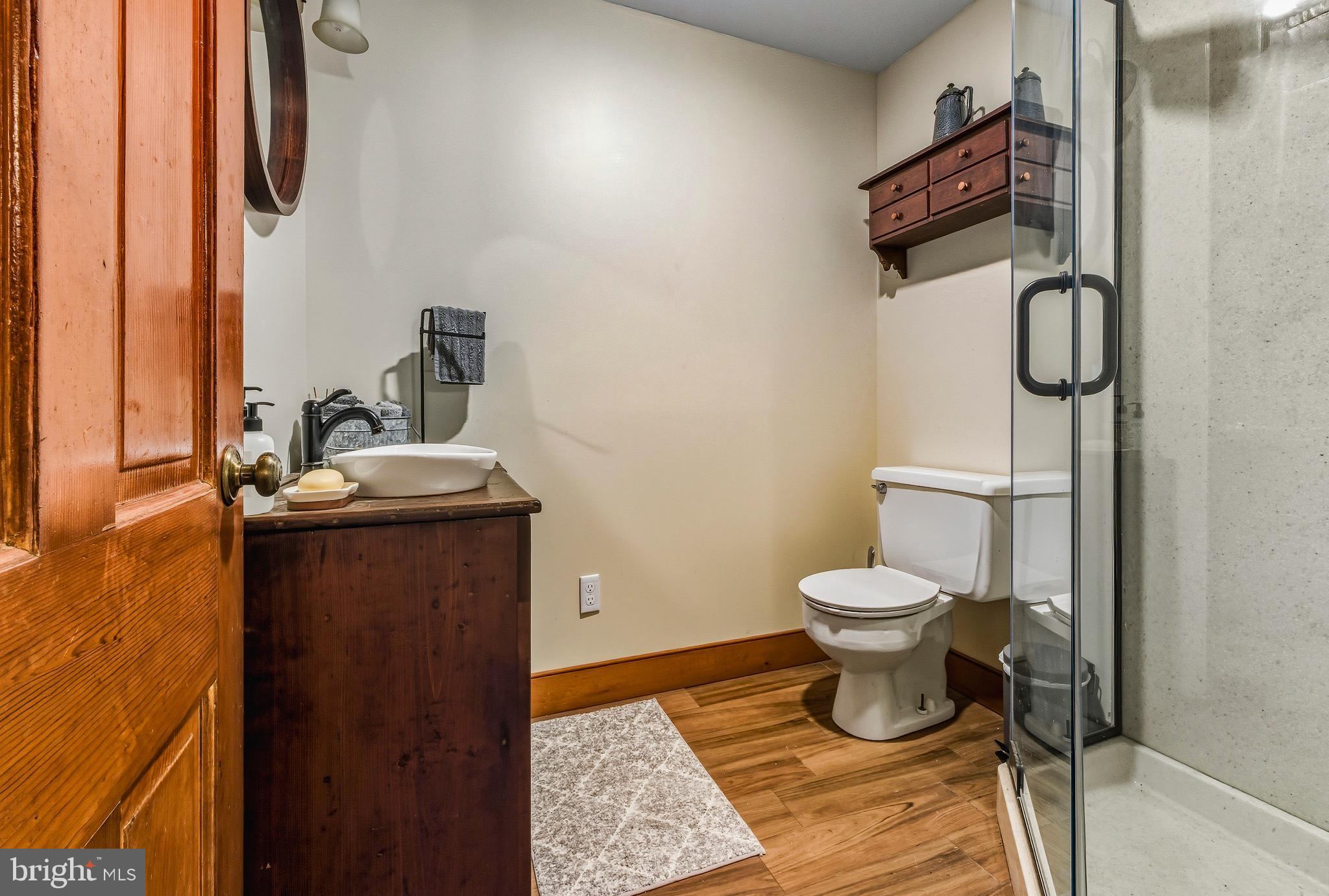 324 Welchville Road Mannington, NJ 08079 - Photo 30 of 50 a bathroom with a toilet and a sink