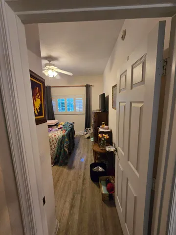 a view of a chairs and table in patio with a lake view