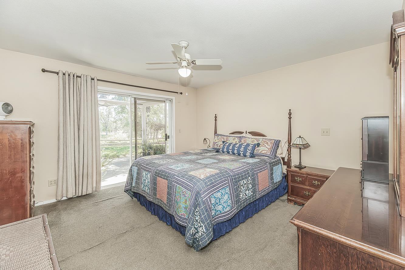 14815 Garlock Lane Prather, CA 93651 - Photo 20 of 80 a bed sitting in a spacious bedroom next to a window