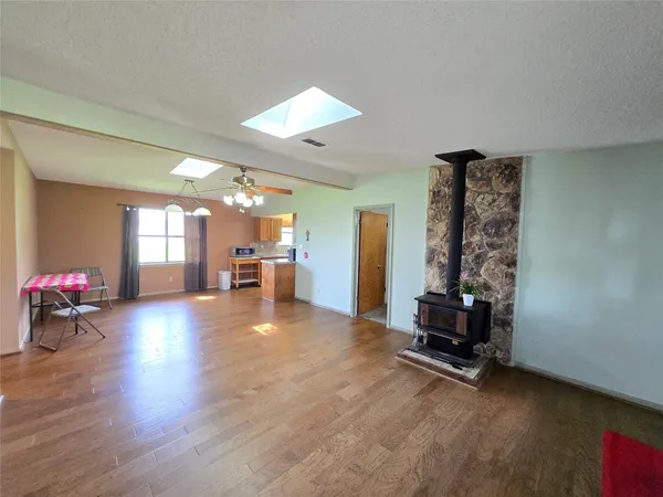 a view of a livingroom with furniture and wooden floor