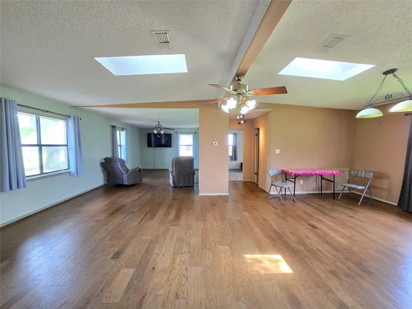 a bedroom with a bed furniture and wooden floor