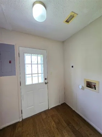 a view of a house with a tree and a yard