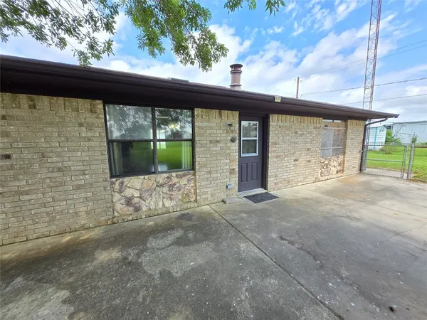 a view of front door of house with yard