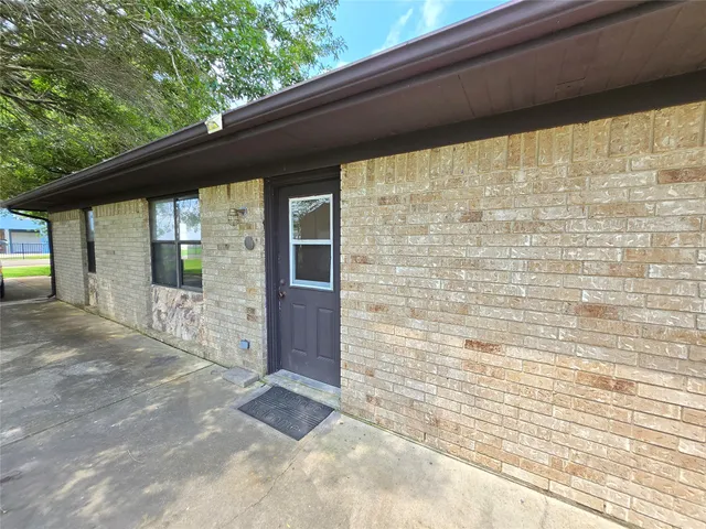 a view of front door of house with yard