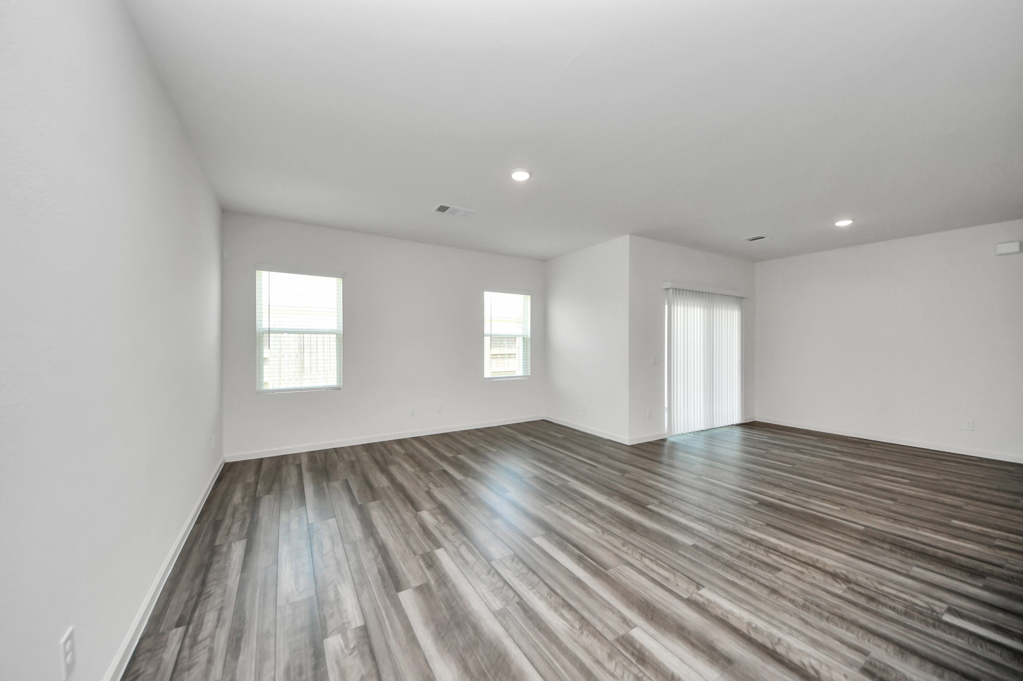 10315 Malta Trce Drive, Unit B Rosharon, TX 77583 - Photo 17 of 49 wooden floor in an empty room with a window