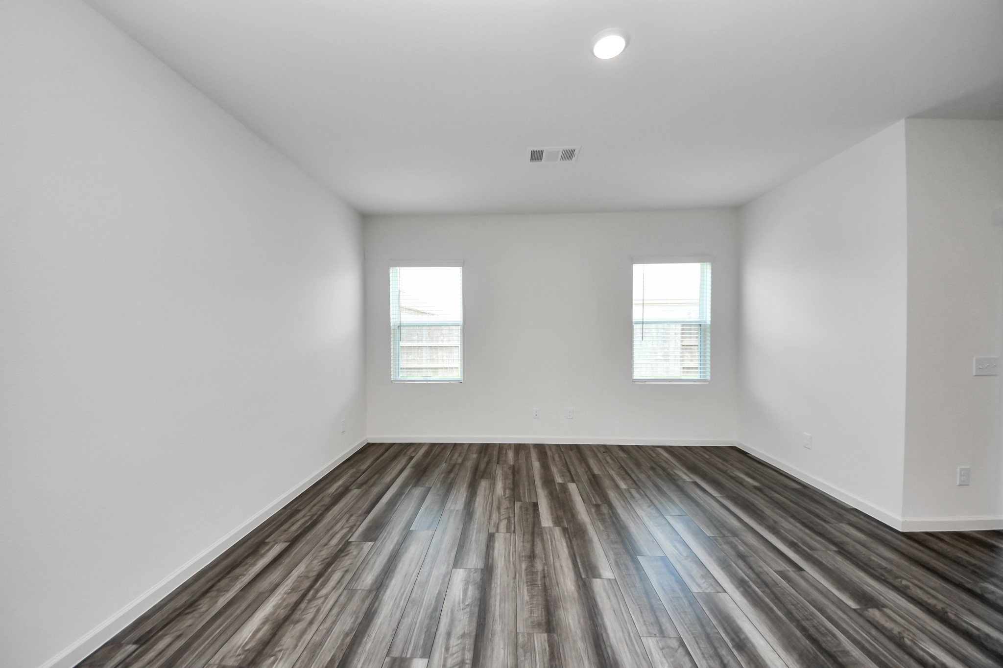 10315 Malta Trce Drive, Unit B Rosharon, TX 77583 - Photo 19 of 49 wooden floor in an empty room with a window