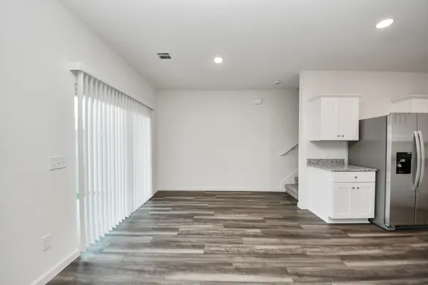 a view of a kitchen with a sink dishwasher and a refrigerator