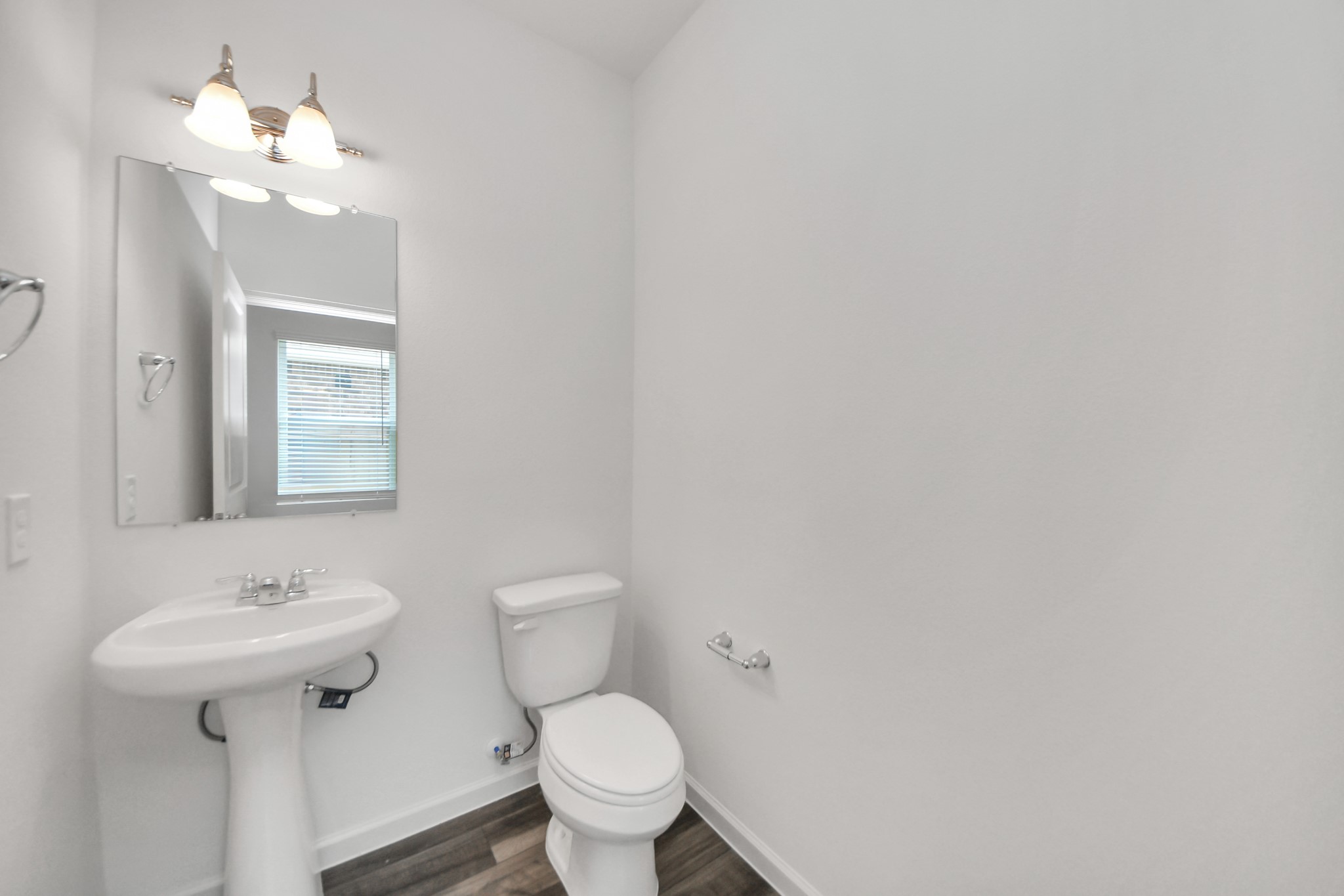 10315 Malta Trce Drive, Unit B Rosharon, TX 77583 - Photo 22 of 49 a bathroom with a toilet sink and mirror