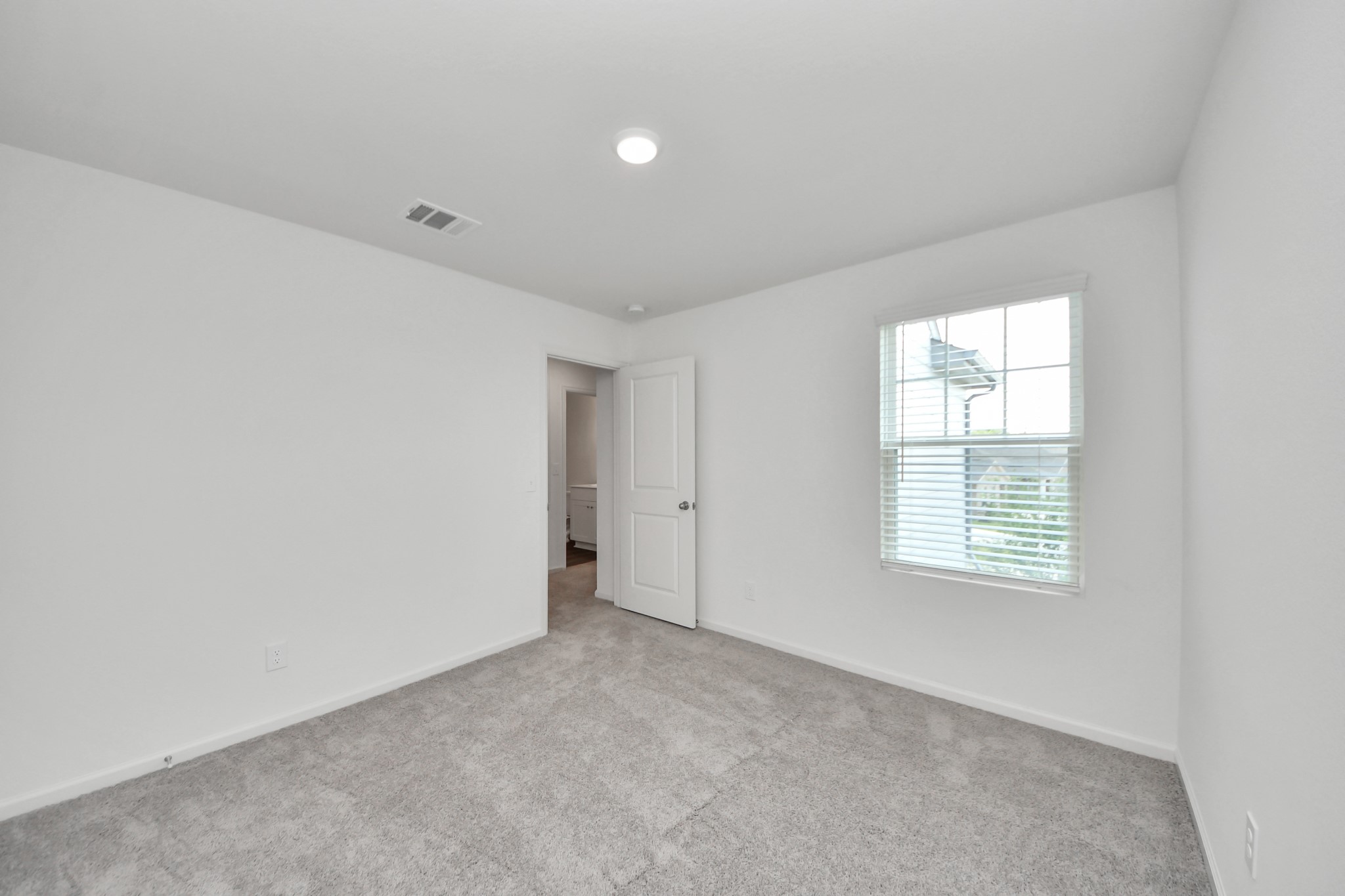 10315 Malta Trce Drive, Unit B Rosharon, TX 77583 - Photo 25 of 49 an empty room with windows