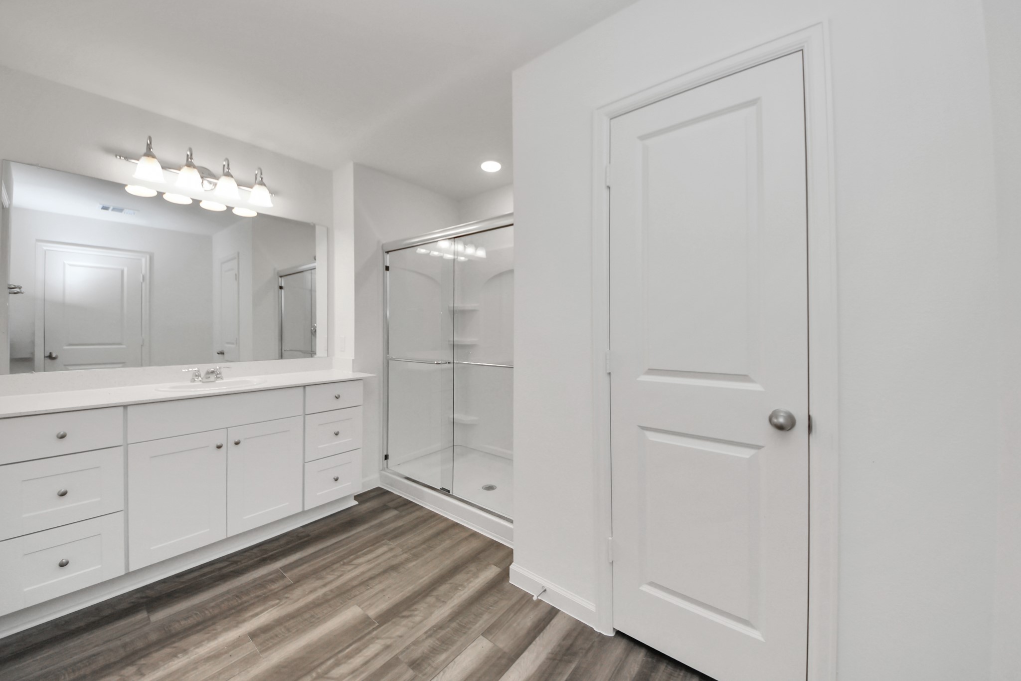 10315 Malta Trce Drive, Unit B Rosharon, TX 77583 - Photo 34 of 49 a spacious bathroom with a shower a sink and a mirror