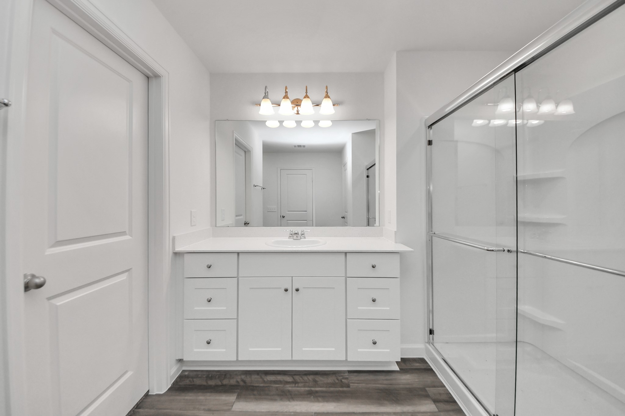 10315 Malta Trce Drive, Unit B Rosharon, TX 77583 - Photo 35 of 49 a bathroom with a sink shower and a mirror