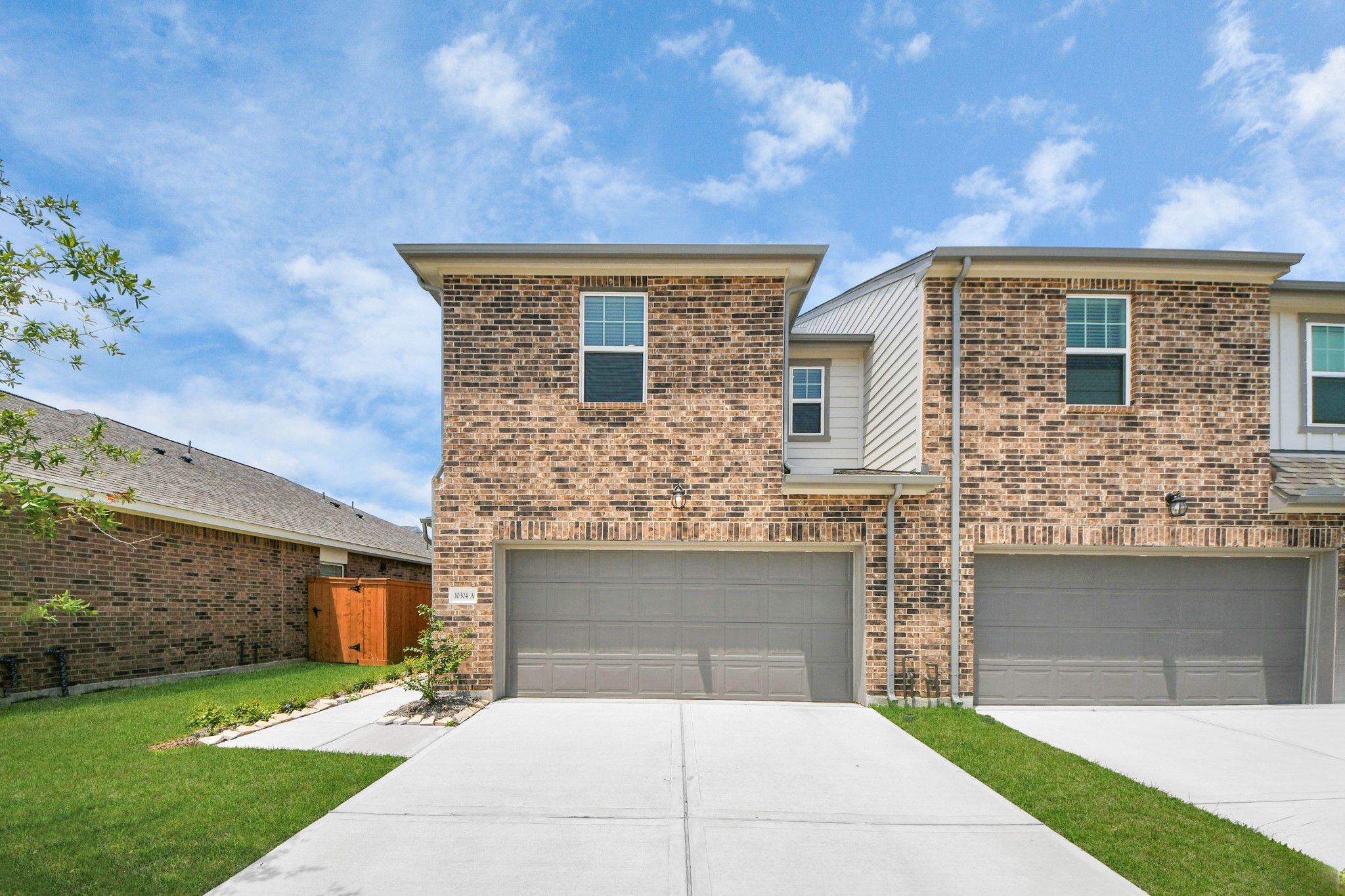 10315 Malta Trce Drive, Unit B Rosharon, TX 77583 - Photo 10 of 49 a front view of a house with a garden and yard