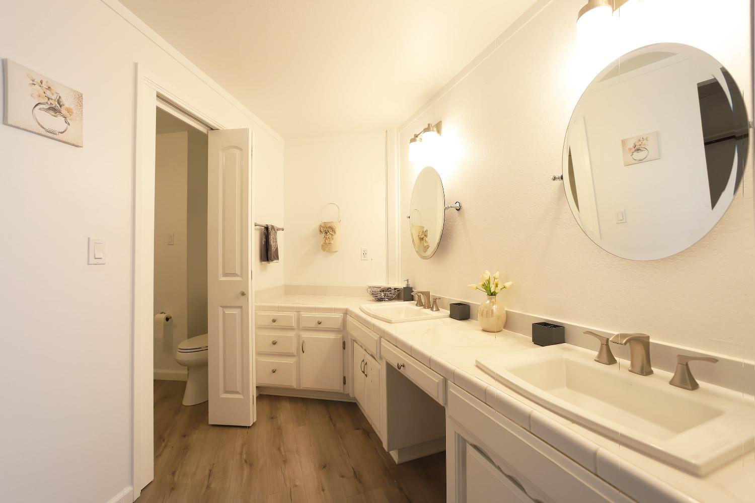 1870 Cable Road Camino, CA 95709 - Photo 27 of 36 a bathroom with a double vanity sink mirror and
