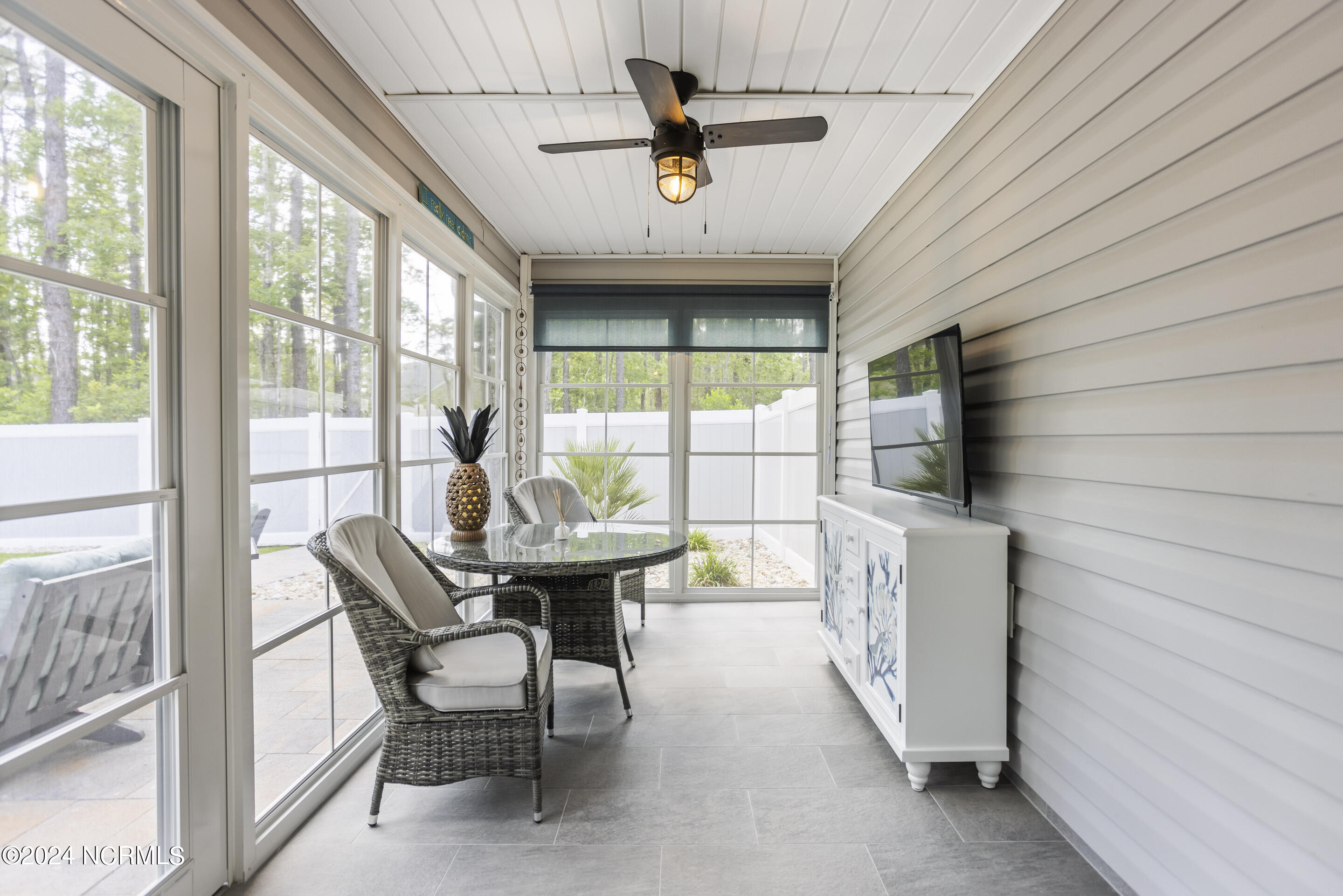 199 Boundary Loop Road Northwest Calabash, NC 28467 - Photo 32 of 45 Rear EZ Breeze enclosed porch w/screen
