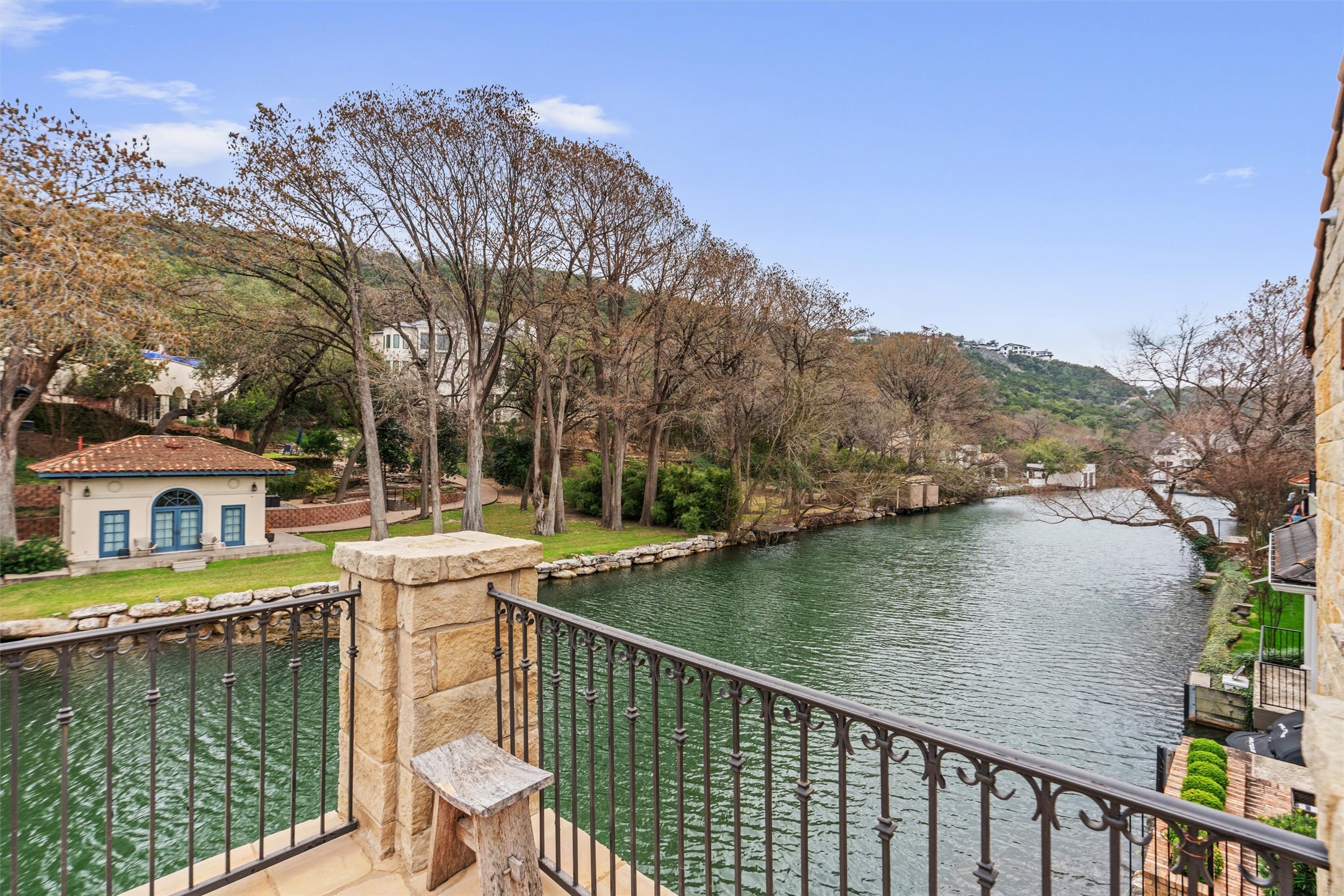 4407 Island Cove Austin, TX 78731 - Photo 26 of 40 a view of a lake with a house in the background