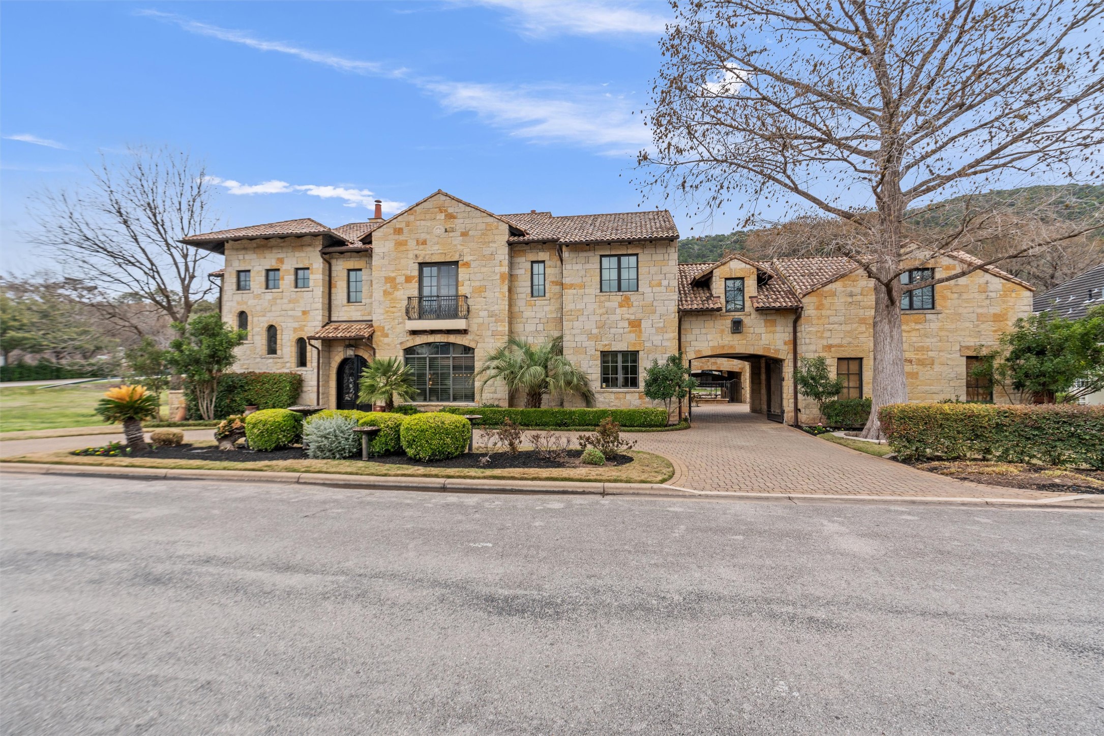4407 Island Cove Austin, TX 78731 - Photo 3 of 40 a front view of a building with a garden and plants