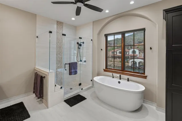 a bathroom with a bathtub and a shower