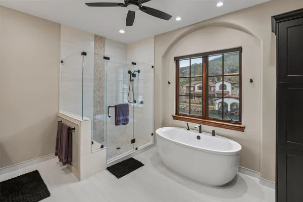a bathroom with a bathtub and a shower