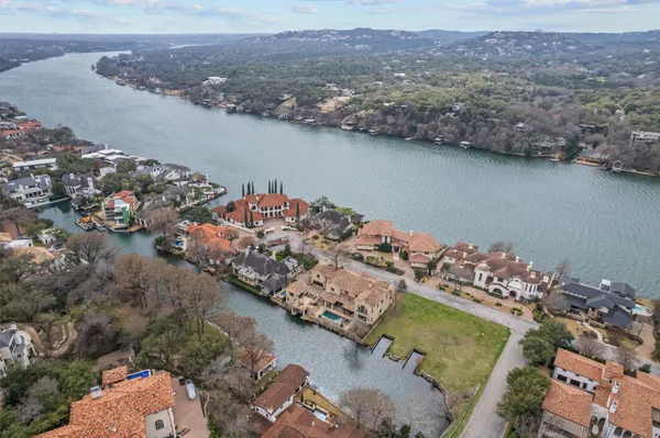 an aerial view of a house with a lake view