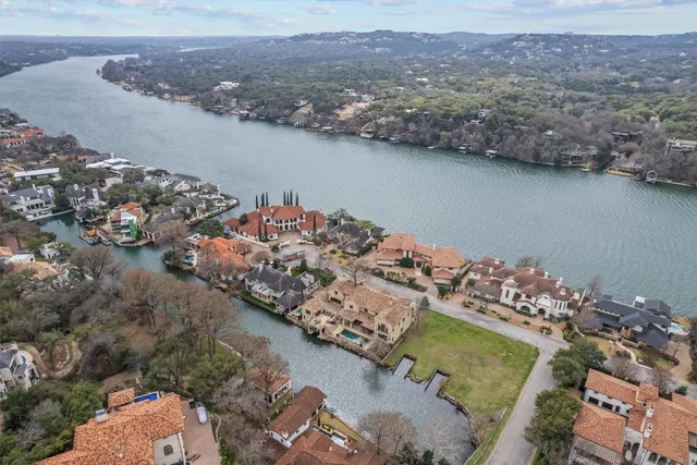 an aerial view of a house with a lake view
