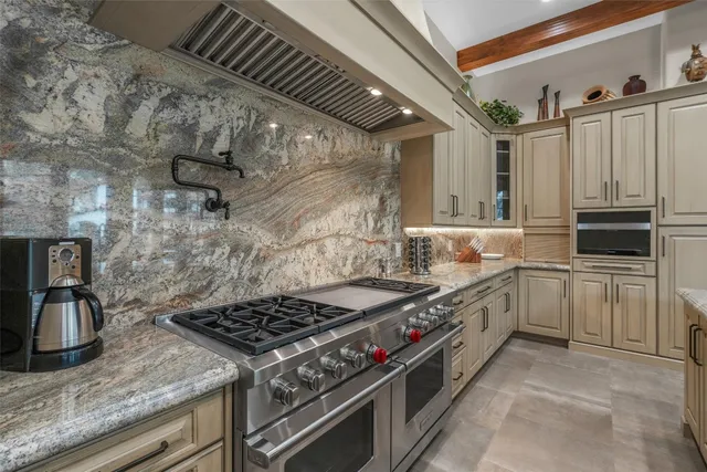 a kitchen with a stove and a sink