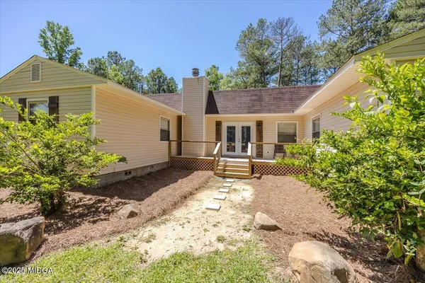 a house with trees in front of it