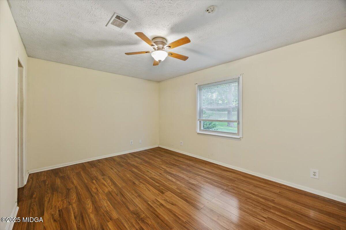 143 Ragan Drive Gray, GA 31032 - Photo 11 of 19 a view of empty room with wooden floor