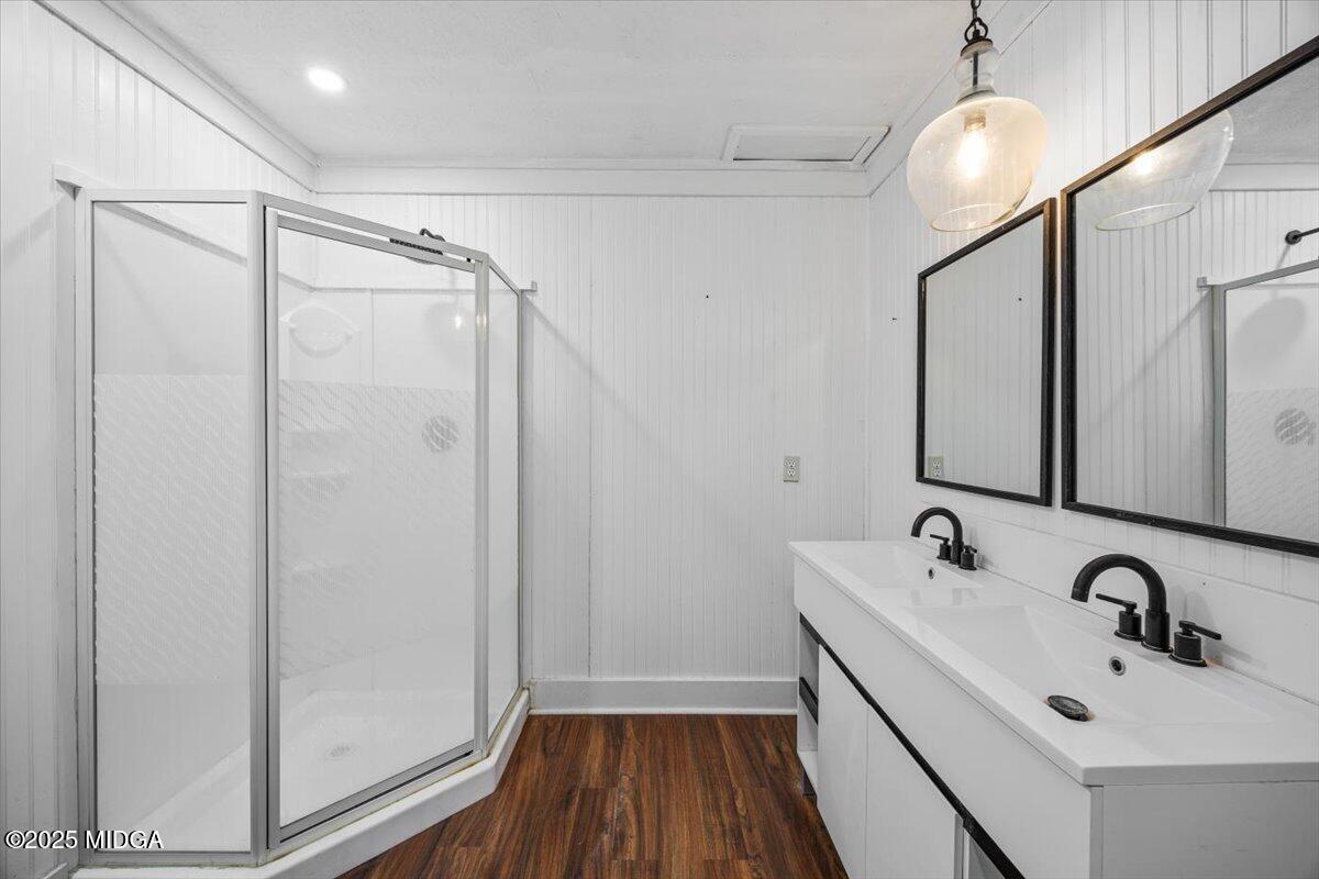 143 Ragan Drive Gray, GA 31032 - Photo 13 of 19 a bathroom with a sink a mirror a vanity and shower