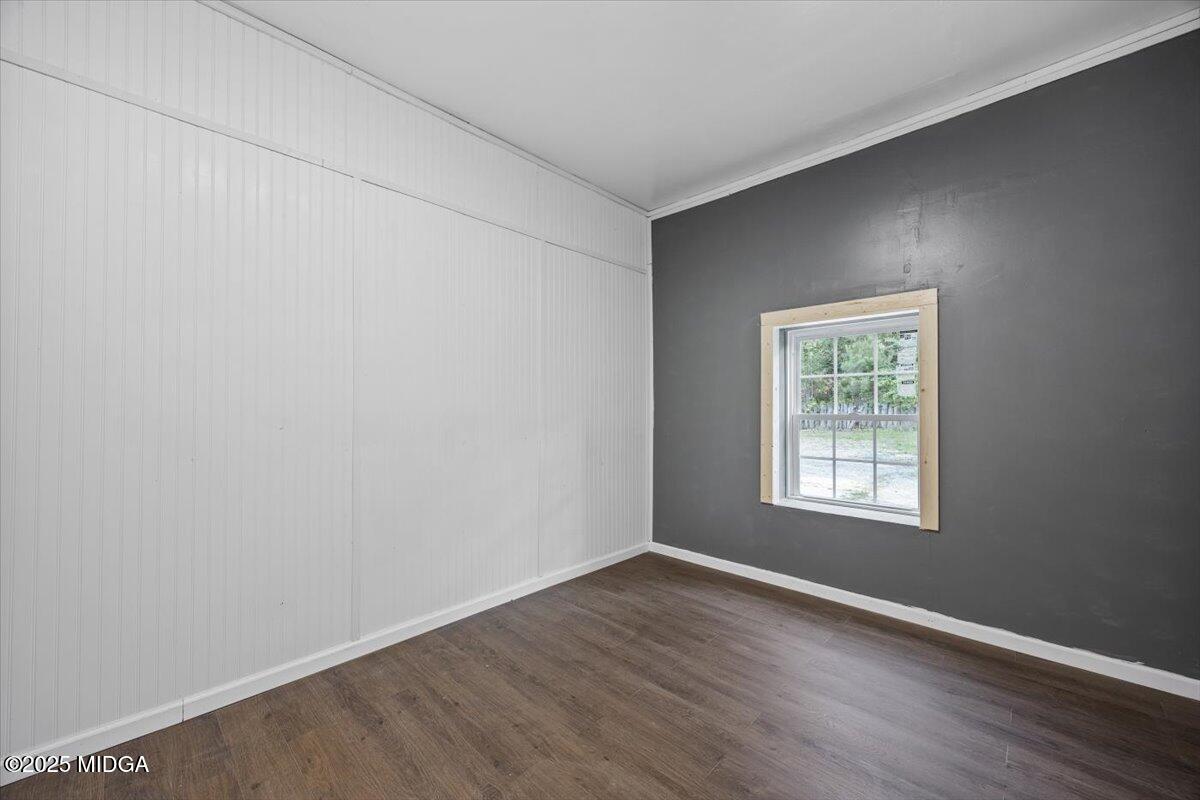 143 Ragan Drive Gray, GA 31032 - Photo 14 of 19 an empty room with wooden floor and windows