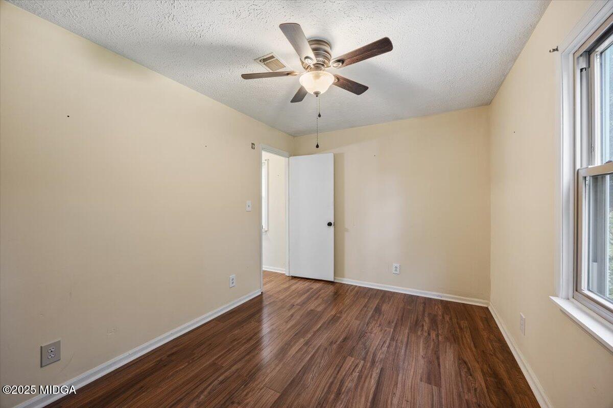 143 Ragan Drive Gray, GA 31032 - Photo 19 of 19 wooden floor in an empty room with a window