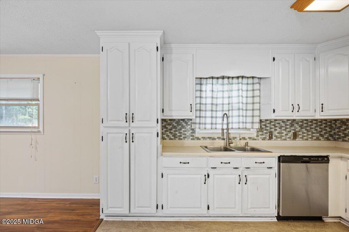143 Ragan Drive Gray, GA 31032 - Photo 5 of 19 a kitchen with white cabinets and sink