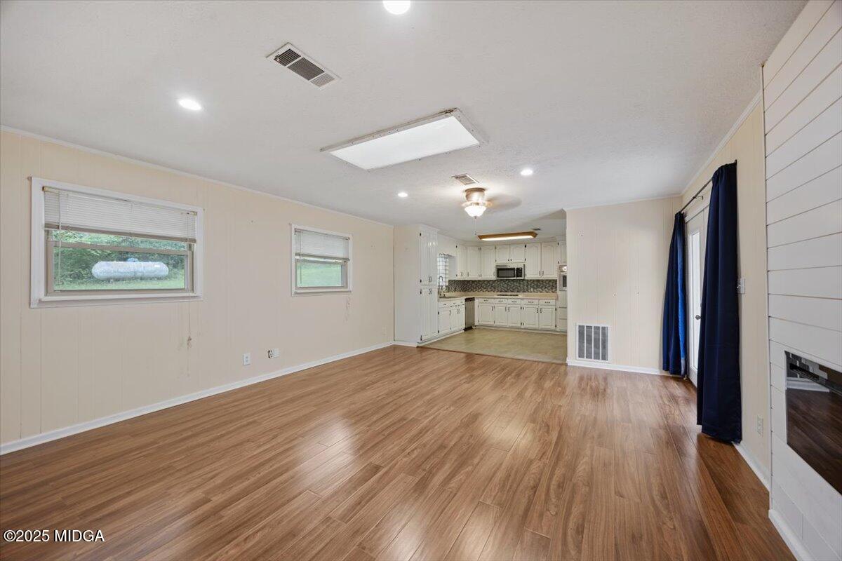 143 Ragan Drive Gray, GA 31032 - Photo 10 of 19 a view of empty room with wooden floor and window