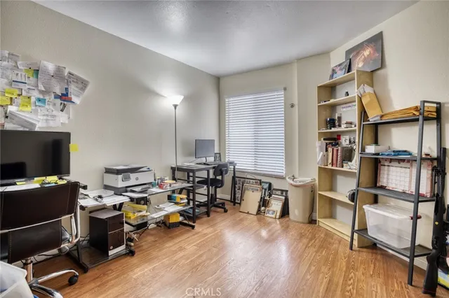 a view of a workspace with furniture and a workspace