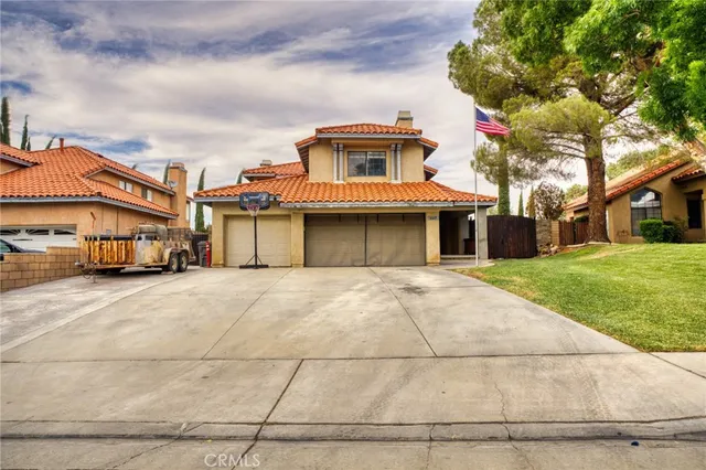 a front view of a building with a garden