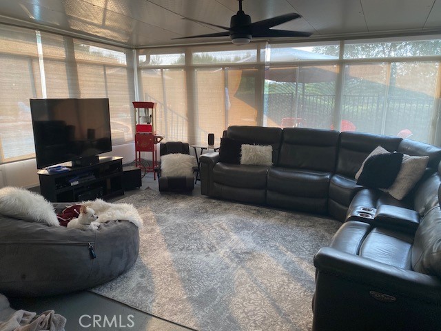 29095 Madrid Road Laguna Niguel, CA 92677 - Photo 14 of 36 a living room with furniture and a flat screen tv
