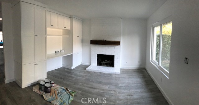 29095 Madrid Road Laguna Niguel, CA 92677 - Photo 5 of 36 a view of an empty room with a fireplace and a window