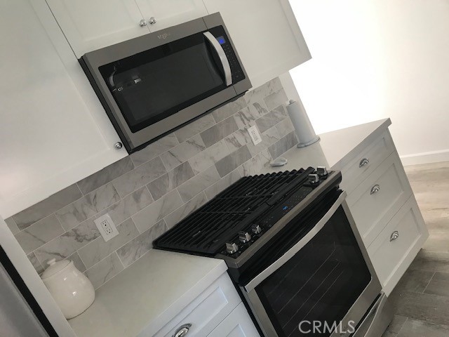 29095 Madrid Road Laguna Niguel, CA 92677 - Photo 7 of 36 a close view of stove and microwave