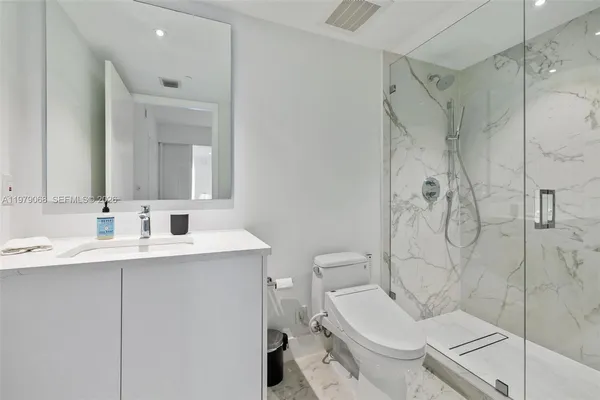a view of bathroom with dual sinks