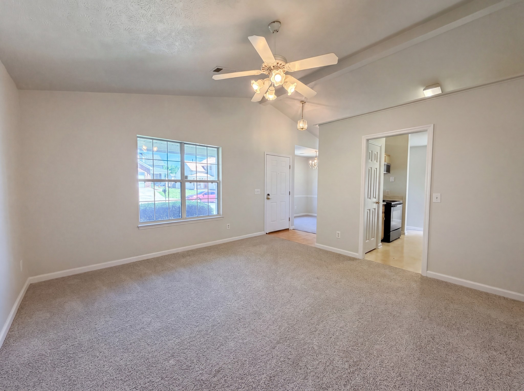 609 Sandy Spring Trail Madison, TN 37115 - Photo 8 of 16 an empty room with a chandelier fan and windows
