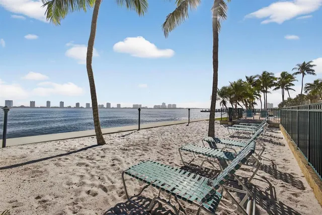 a swimming pool with outdoor seating and yard