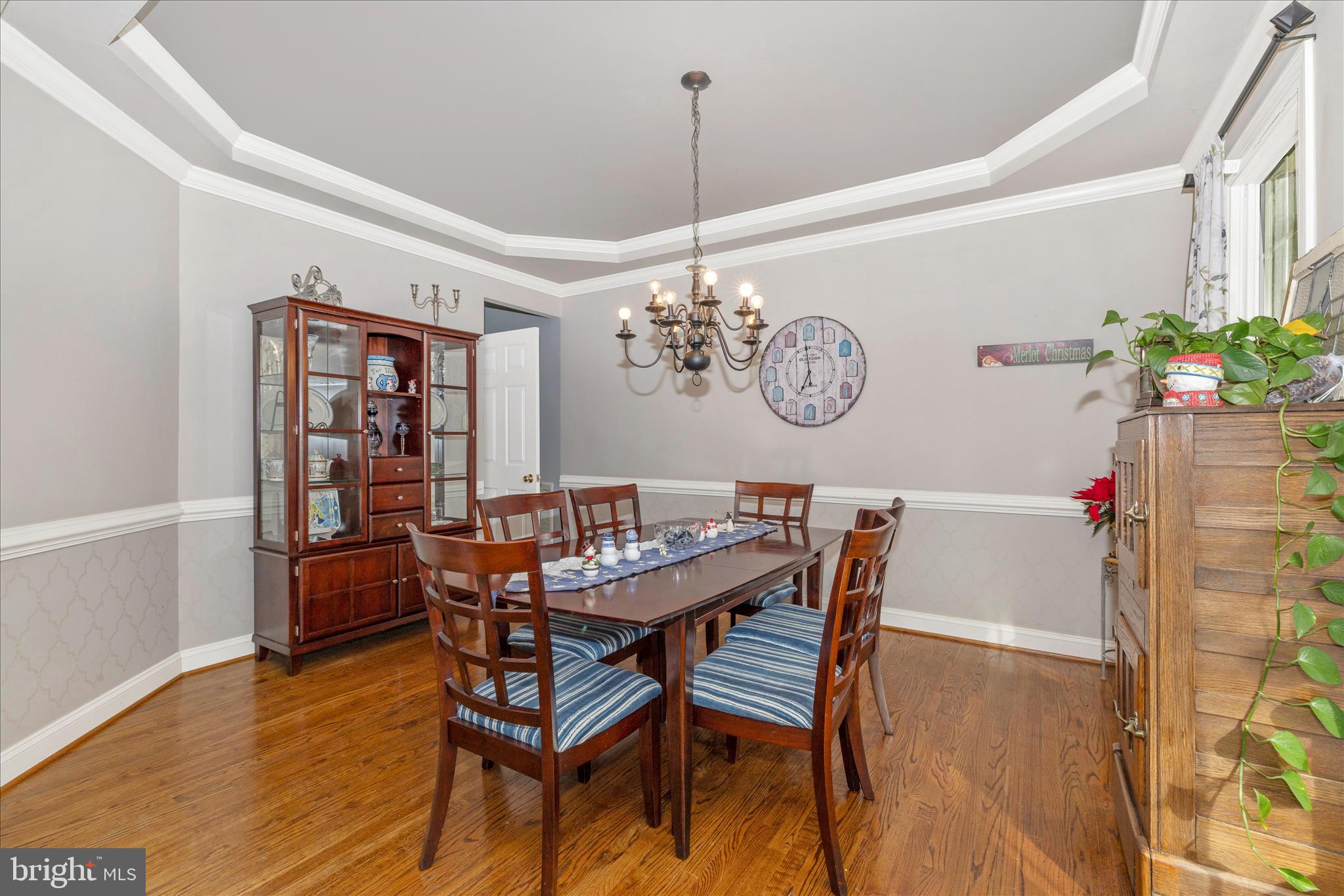 11306 Country Club Road New Market, MD 21774 - Photo 13 of 77 a view of a dining room with furniture and wooden floor