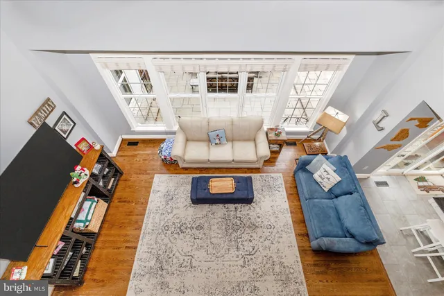 a kitchen with sink a microwave and cabinets