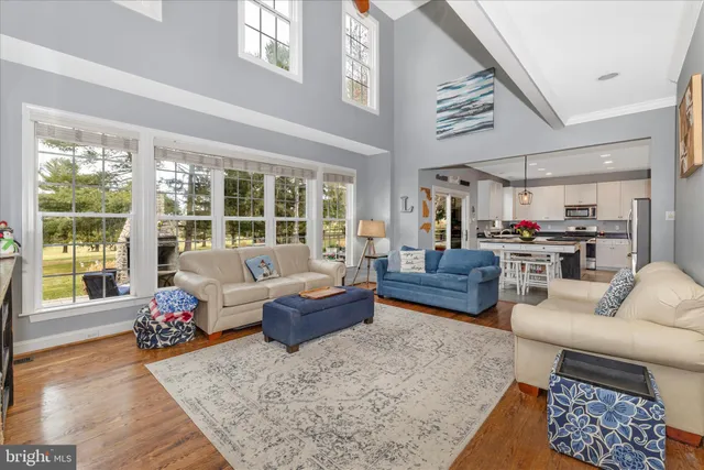 a spacious bedroom with a bed and a flat screen tv