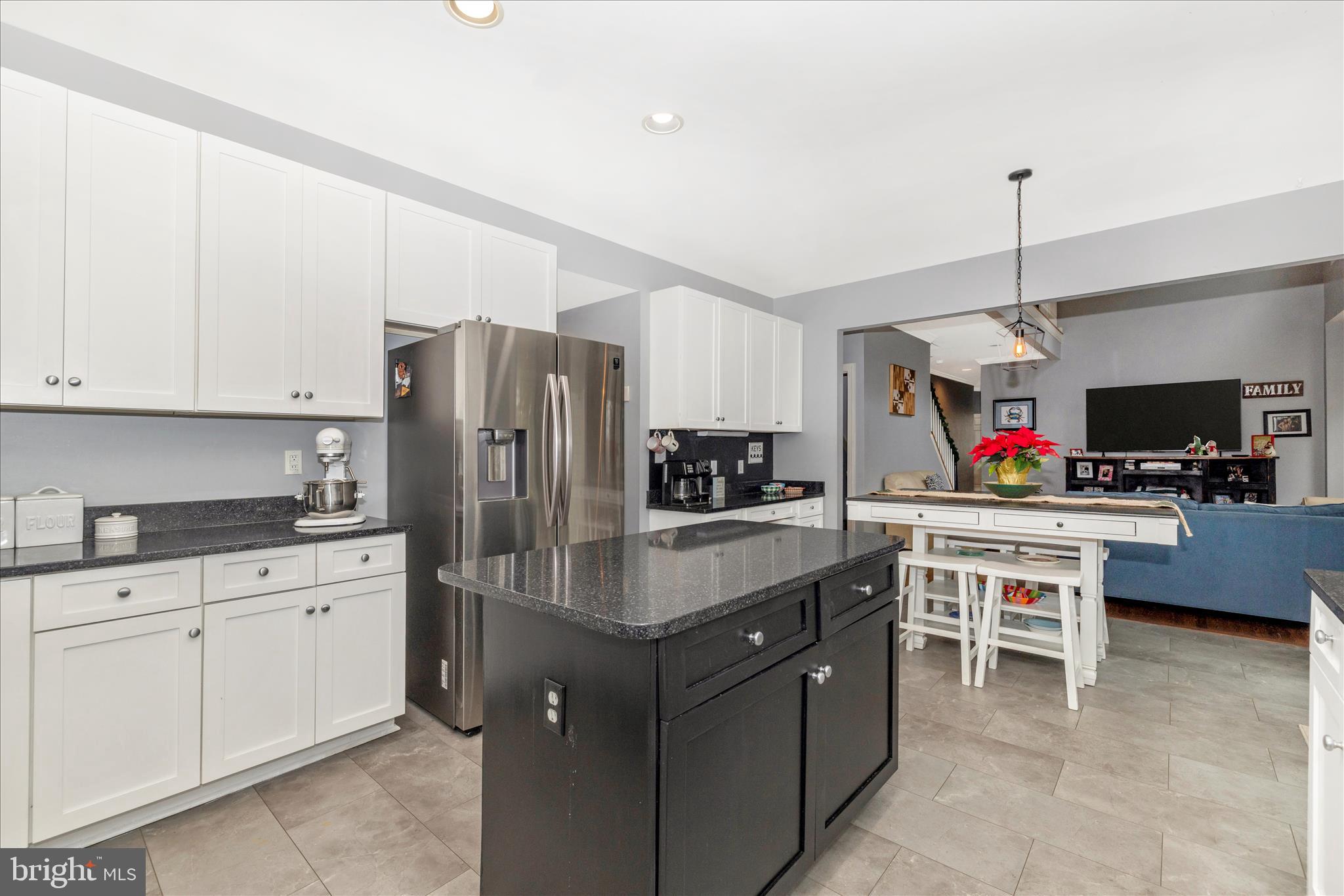 11306 Country Club Road New Market, MD 21774 - Photo 23 of 77 a kitchen with stainless steel appliances granite countertop a refrigerator oven a sink dishwasher and white cabinets with wooden floor