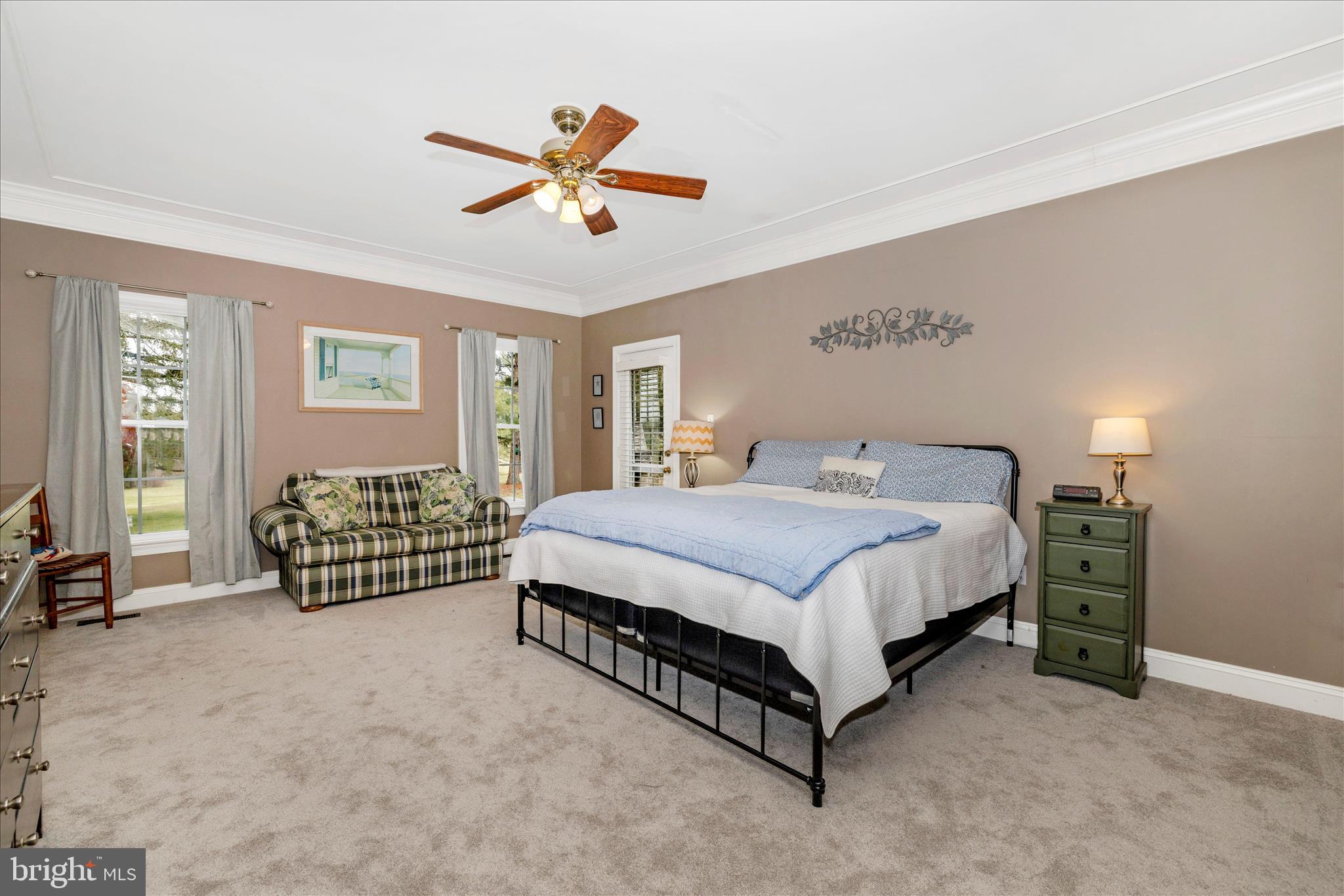 11306 Country Club Road New Market, MD 21774 - Photo 27 of 77 a spacious bedroom with a bed a chandelier and a window