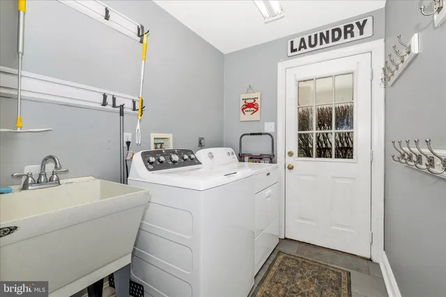 a bathroom with a sink and mirror with toilet