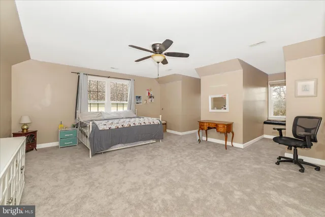 a bathroom with a sink and mirror with toilet