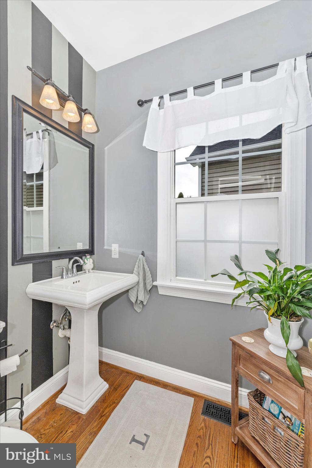 11306 Country Club Road New Market, MD 21774 - Photo 37 of 77 a bathroom with a sink a mirror and a window