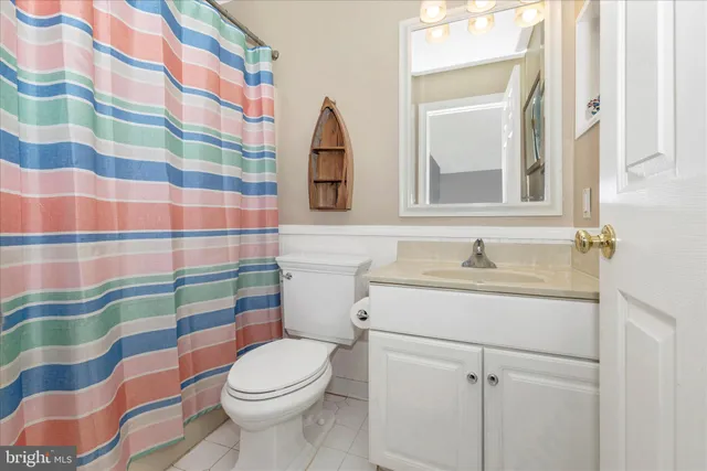 a spacious bedroom with a bed and a cabinets