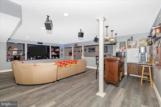 a front view of a building with trees